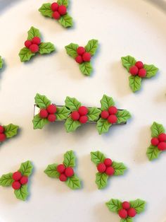 Festive holiday hair clip. Holly leaves with red berries. Three charms on a 2.4" clip.  This is a handmade product so please handle with care. The adhesive is strong, but please avoid dropping to prevent breakage. Do not submerge in water or subject to extreme heat. Individual charms can be a choking hazard for young children. One clip in order. Holiday Hair Clips, Christmas Clay, Holiday Hairstyles, Holly Leaf, Red Berries, Clip Ins, Barrettes, Holiday Festival, Hair Clips