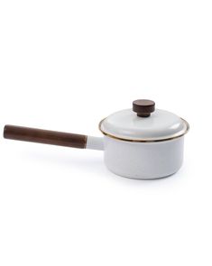 a white and brown pot with a wooden handle