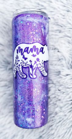 a purple tumbler with the word mama painted on it's side and an image of a bear