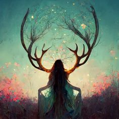 a woman with long hair sitting in front of a deer's head and surrounded by trees