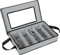 an open box with silverware in it on a white background, including forks and spoons