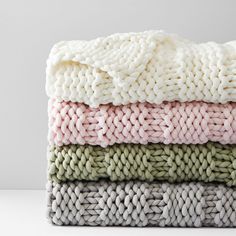 three blankets stacked on top of each other