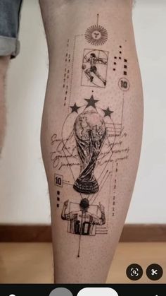 a person with a tattoo on their leg that has the world cup drawn on it