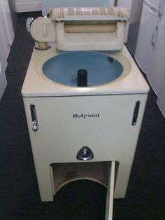 an old fashioned toilet with the lid up