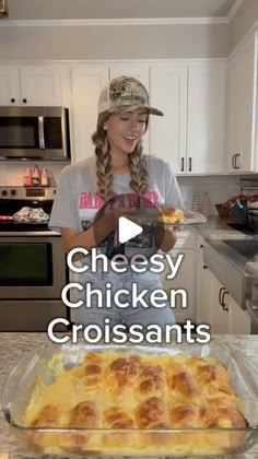 a woman standing in front of a pan filled with cheese chicken croissants