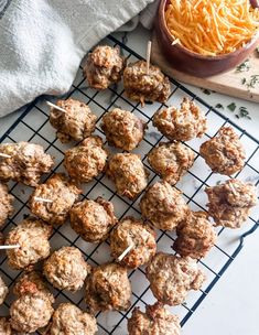 meatballs and cheese are on a cooling rack