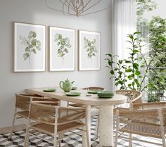 a dining room table with chairs and pictures on the wall above it, in front of a potted plant