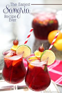 two glasses filled with sangria on top of a table