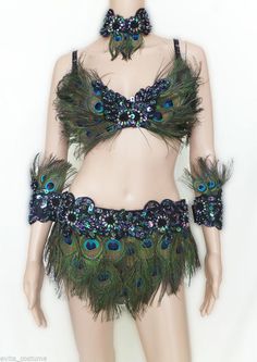 a female mannequin with peacock feathers on it's chest and headdress