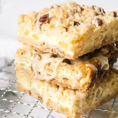 three pieces of cake sitting on top of a cooling rack