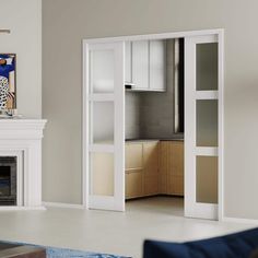 an empty living room with white furniture and fireplace