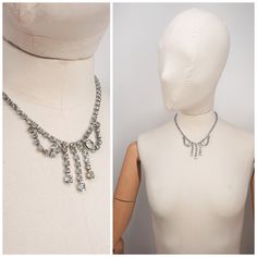 "Beautiful diamanté necklace in a bow design that falls nicely on the neck. Material - Unknown metal nad what appeards to be paste stones. Condition - Excellent. There is a faint blue tint to a couple of stones on the right-side of the bow design. See photos.  Chain measures approx 16\" Length Free Standard Shipping on all UK Orders. If your require an item to be sent via express delivery please contact me for prices and availability.  Feel free to contact me if you have any questions." Bow Design, Pendant Necklaces, Jewelry Necklace Pendant, Silver Tone, Etsy Accessories, Jewelry Necklaces, Accessory Gift, Gift Card, Electronic Accessories