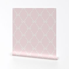 a pink and white wallpaper with an intricate pattern on it's side, against a white background