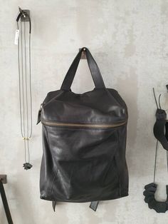 A just-right backpack with a minimalist silhouette, this rich - leather backpack features geometric cut with a deep, lined interior with 2 large departments, a zipper pocket, adjustable strap and a antique gold hardware for an chic updated finishing touch. Features: * 1 Interior large zipped pocket * Outside zipper pocket in the back of the bag * Fully lined with strong Black cotton * 2 departments * Adjustable shoulder strap * zipper closure ◄ DIMENSIONS ► Height: 32 cm/ 12.5'' Width: 33 cm / 1 Backpack Purse Leather, Leather Backpack Women, Small Backpack Purse, Leather Phone Pouch, Small Leather Backpack, Laptop Backpack Women, Small Leather Purse, Mini Backpack Purse, Large Leather Bag