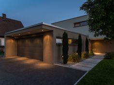 a house with lights on the front and side of it