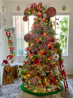 a christmas tree decorated with candy canes and candies