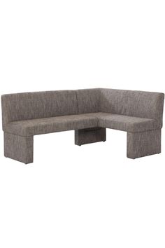 a gray sectional couch sitting on top of a wooden table