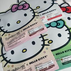 hello kitty candy wrappers sitting on top of each other