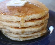 a stack of pancakes with butter on top