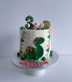 a cake decorated with green and red decorations