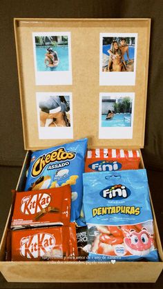 an open box filled with snacks and pictures