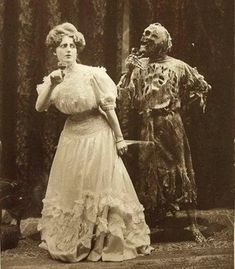 an old black and white photo of two people dressed as zombies