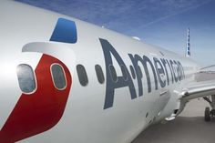 an american airlines plane is parked on the tarmac