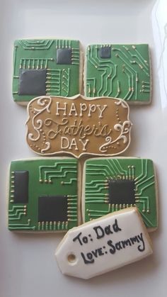 some cookies that have been decorated to look like circuit boards with the words happy mother's day written on them