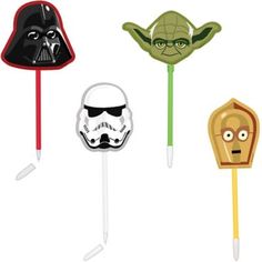 four star wars lollipops with faces on them, including darth vader and storm trooper