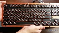 a person is typing on an old fashioned keyboard with lots of holes in the keys