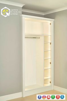 an empty closet with shelves and lights on the wall in a room that is painted white