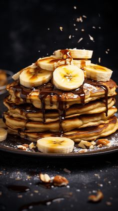 a stack of pancakes topped with bananas and syrup