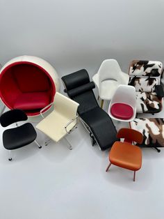 an assortment of modern chairs and footstools