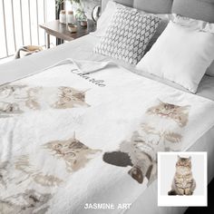 a cat is sitting on top of a bed with white sheets and pillowcases