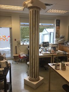 a large pillar in the middle of a room