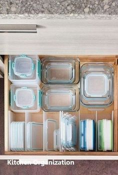 the drawers are organized with plastic containers