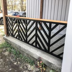 a black metal railing on the side of a building