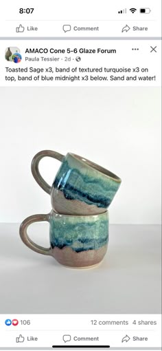 two coffee mugs stacked on top of each other in front of a white background