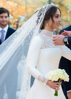 the bride and groom are getting ready to walk down the aisle