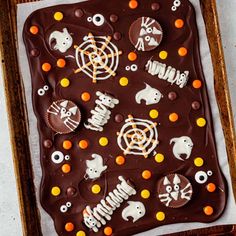 a chocolate cake with halloween decorations on it