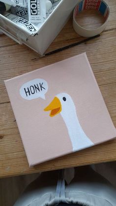 a duck painted on a canvas with the words honk