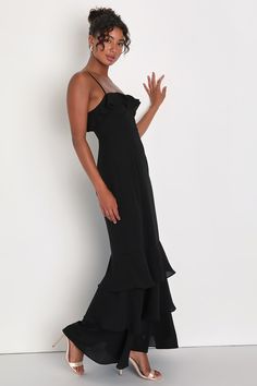 With a fabulous look like the Lulus Lively Evenings Black Sleeveless Tiered Maxi Dress, you're sure to bring an enticing energy to any special occasion! Airy woven chiffon shapes this inspiring dress that features a bustier-style bodice with seamed cups, a straight neckline adorned with flouncy ruffled trim, and adjustable spaghetti straps. The high, fitted waist tops a figure-skimming, A-line skirt that falls to a trendy tiered maxi hem. Hidden back zipper/clasp. Fit: This garment fits true to size. Length: Floor length. Size medium measures 52" from adjustable straps to hem. Bust: Great for any cup size. Waist: Fitted - very fitted at natural waist. Hip: Loosely Fitted. Undergarments: May be worn with a strapless bra, adhesive bra, petals, or no bra. Fabric: Fabric has no stretch. Lined. Strapless Midi Dress With Ruffle Hem For Evening, Sleeveless Ruffle Evening Dress For Night Out, Flowy Chiffon Evening Dress With Ruffle Hem, Elegant Chiffon Party Dress With Ruffle Hem, Elegant Chiffon Maxi Dress With Ruffle Hem, Chic Sleeveless Evening Dress With Ruffles, Flowy Chiffon Dress With Ruffle Hem For Party, Chic Chiffon Evening Dress With Ruffle Hem, Party Chiffon Dress With Ruffle Hem