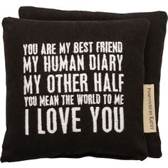 two black pillows with white writing on them, one says you are my best friend and the other says i love you