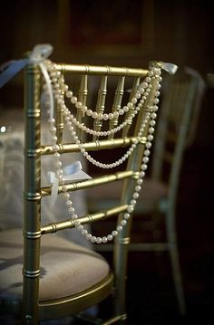 a chair with pearls on the back