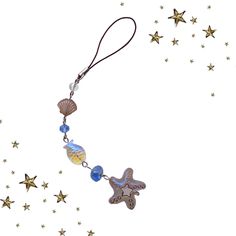 a starfish and sea glass bead necklace with gold stars on a white background