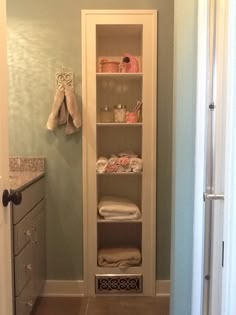 the bathroom is clean and ready to be used as a storage area for towels or other items