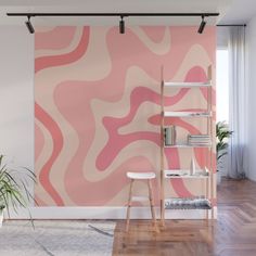 an orange and pink wall mural in a living room