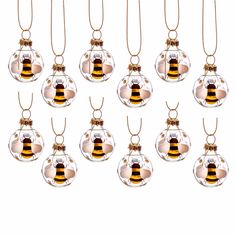 twelve glass baubles with a yellow and black bee on them