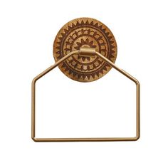 an antique brass towel ring with a circular design on the front and back of it