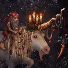 a man riding on the back of a white horse with candles in it's horns